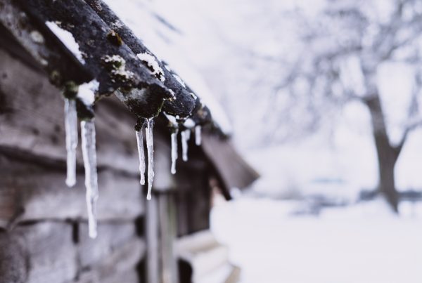 How Snow and Ice Dams Damage Your Roof