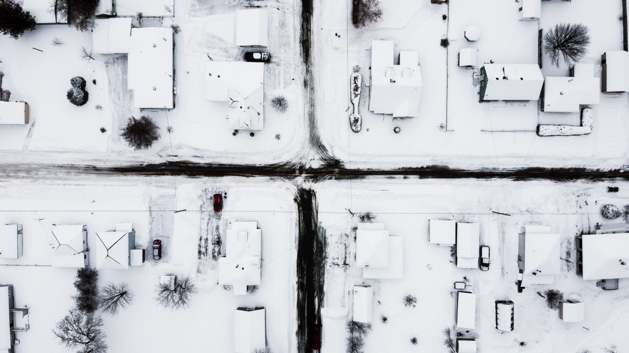 How Snow and Ice Affect Your Roof - Aerial view of neighborhood