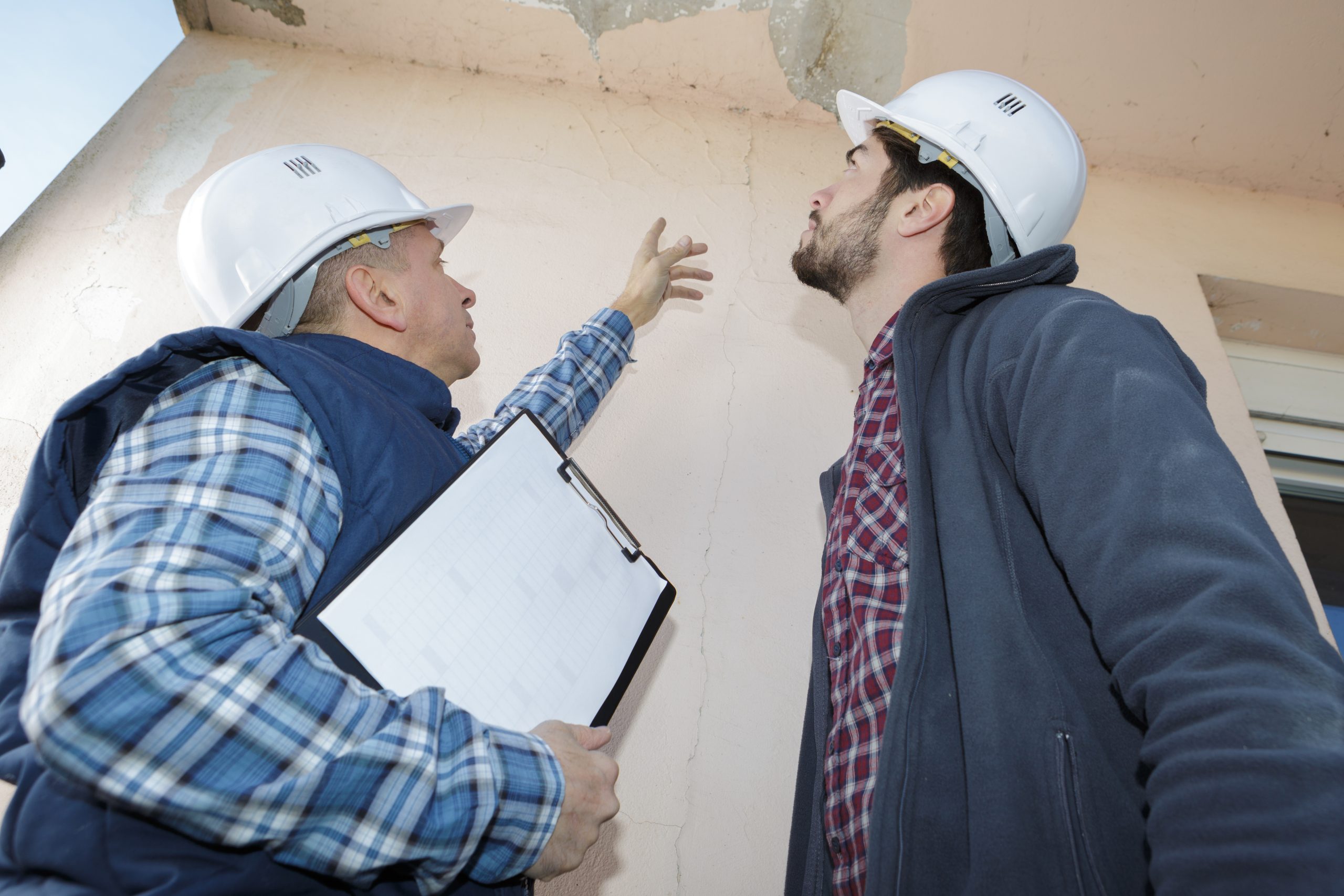 building inspectors identify roof damage