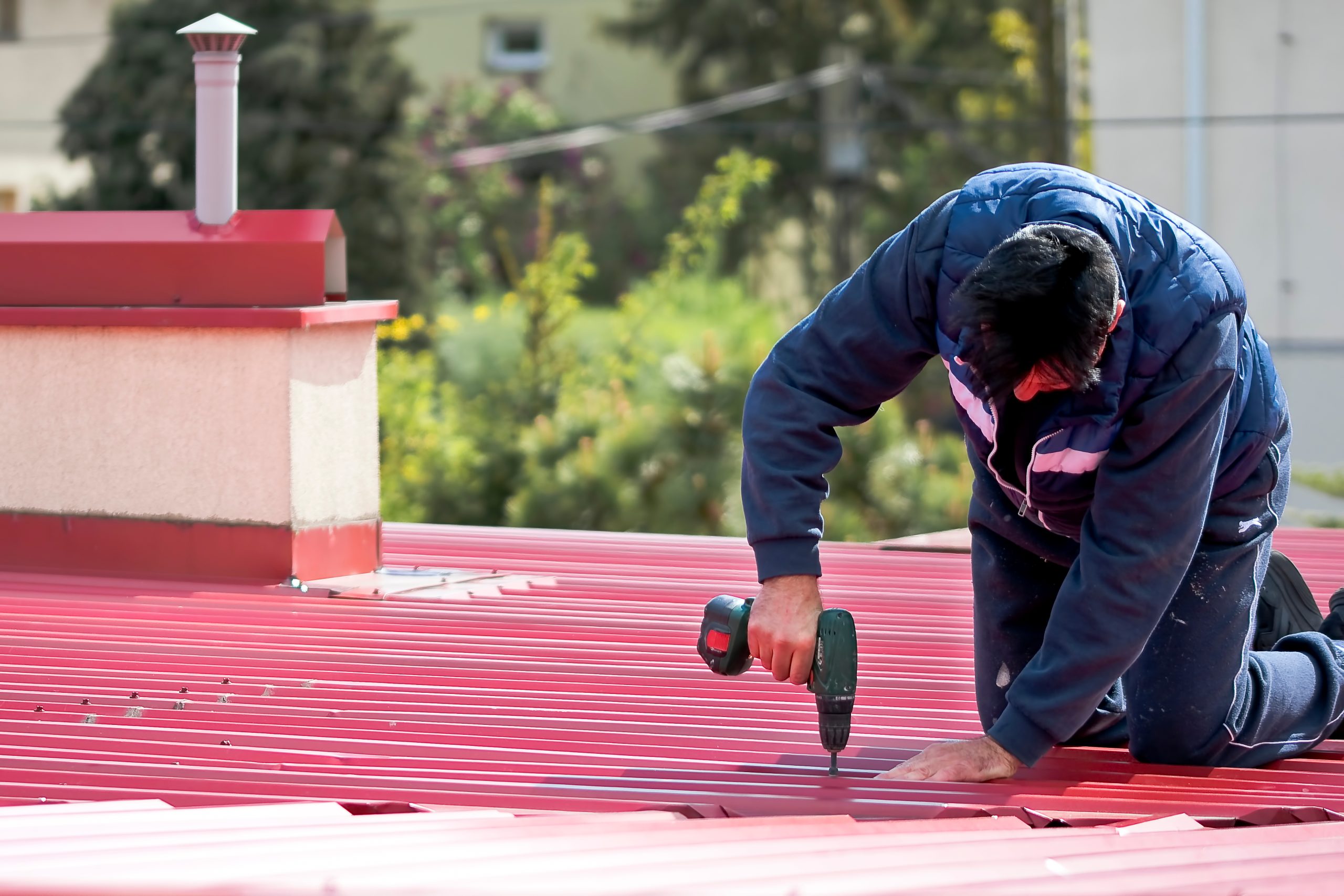 commercial roof maintenance guy repairs roof